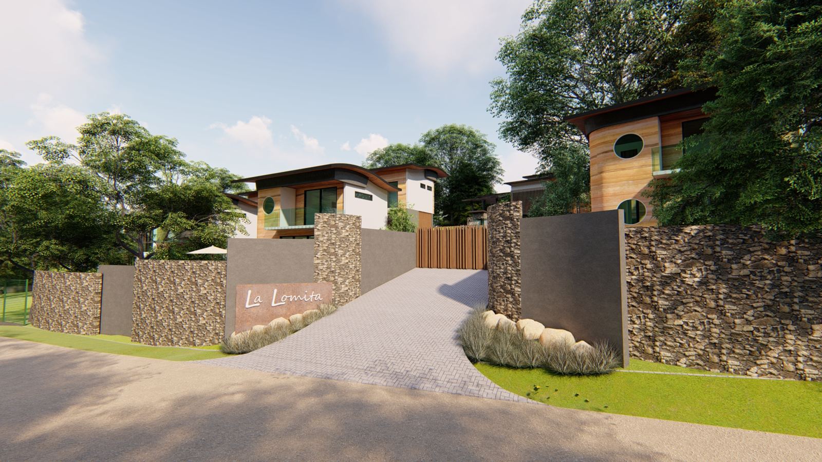 Entrance to La Lomita: stone walls, wooden gate and houses among trees